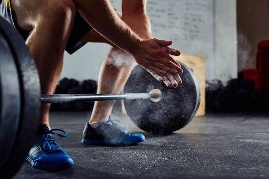 Member weightlifting with a barbell